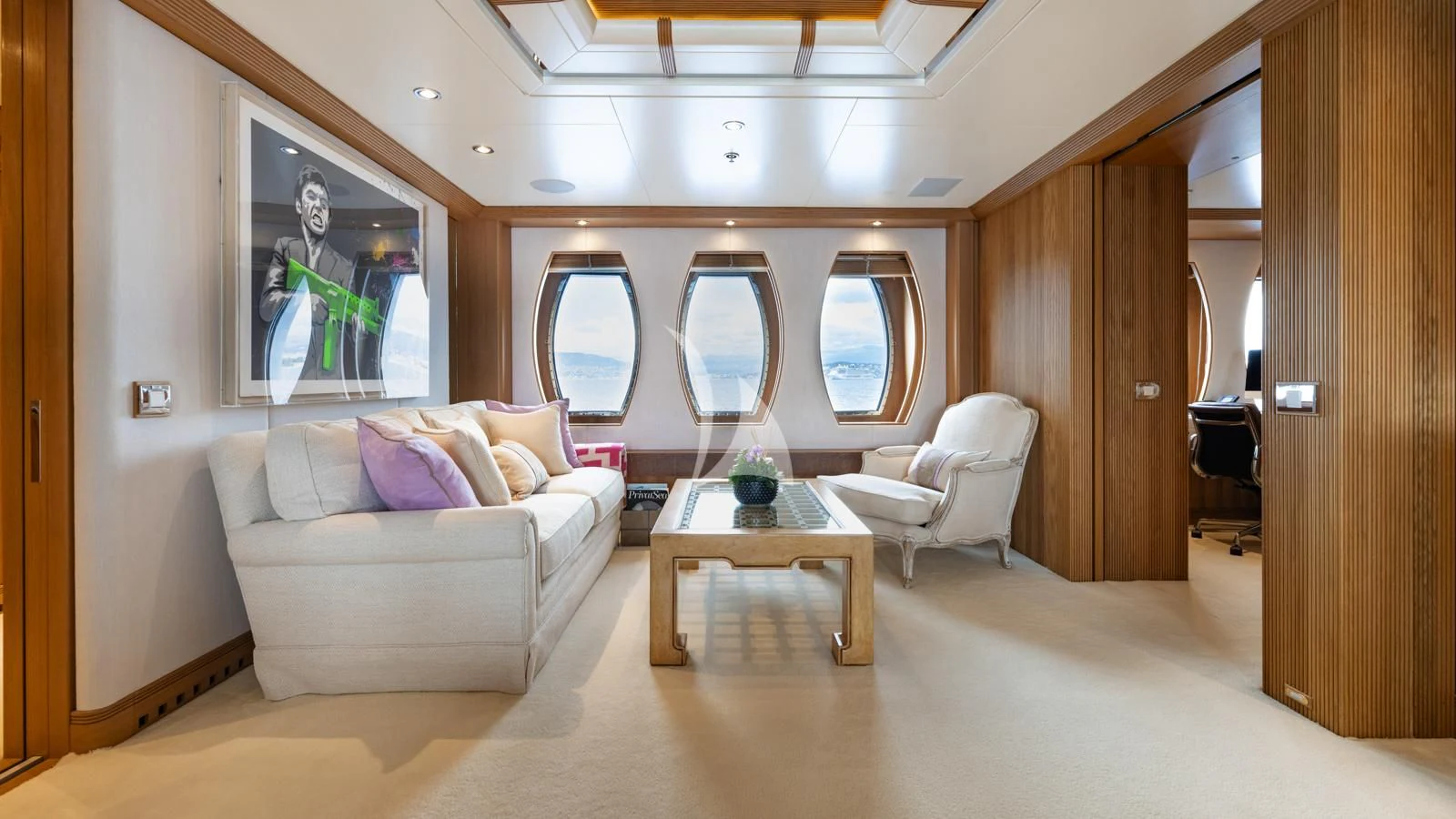 a living room with a couch and a table aboard MARLA Yacht for Sale