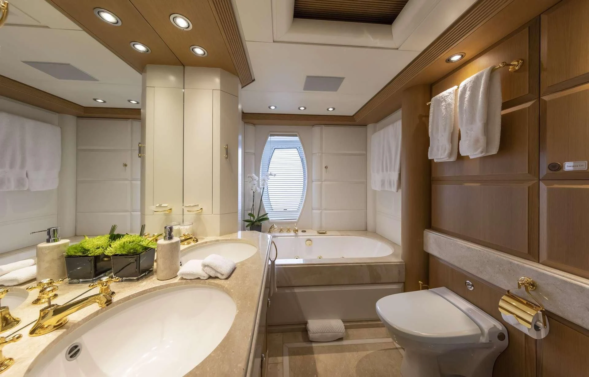 a bathroom with a tub sink and toilet aboard MARLA Yacht for Sale