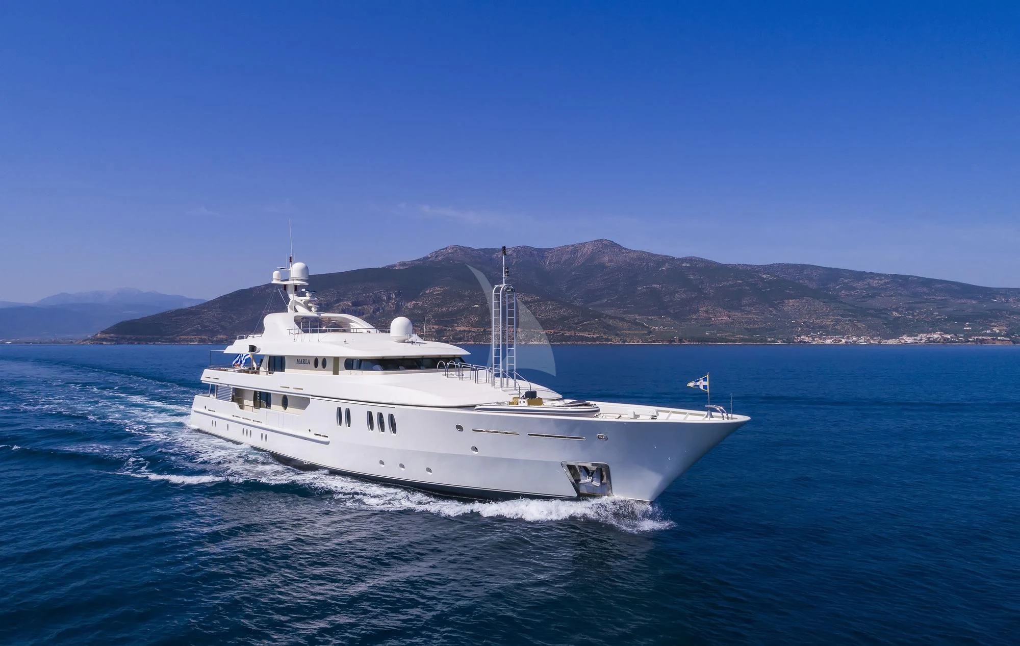 a white boat on the water aboard MARLA Yacht for Sale