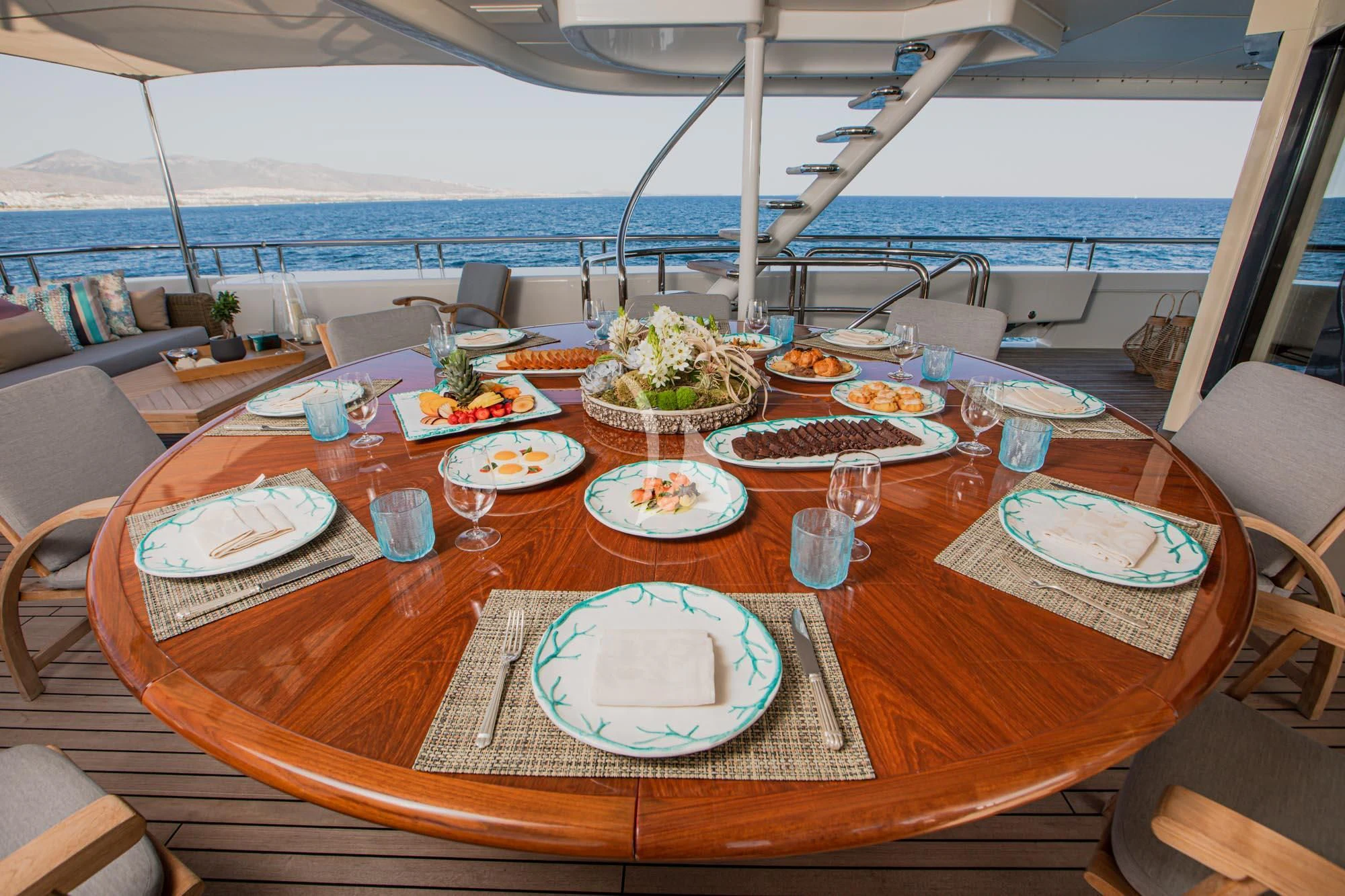 a table with plates and food on it aboard MARLA Yacht for Sale