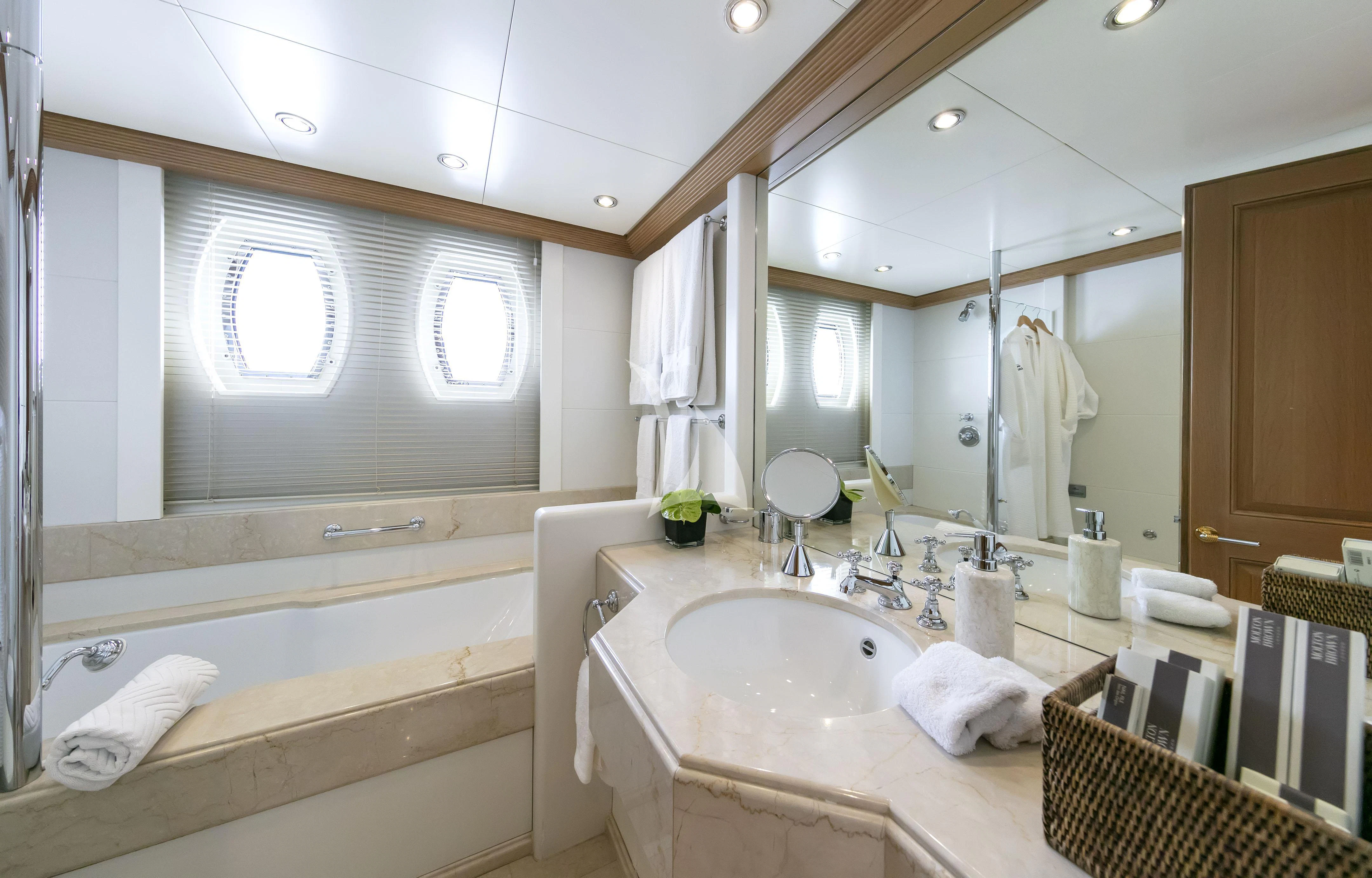 a bathroom with a large mirror aboard MARLA Yacht for Sale