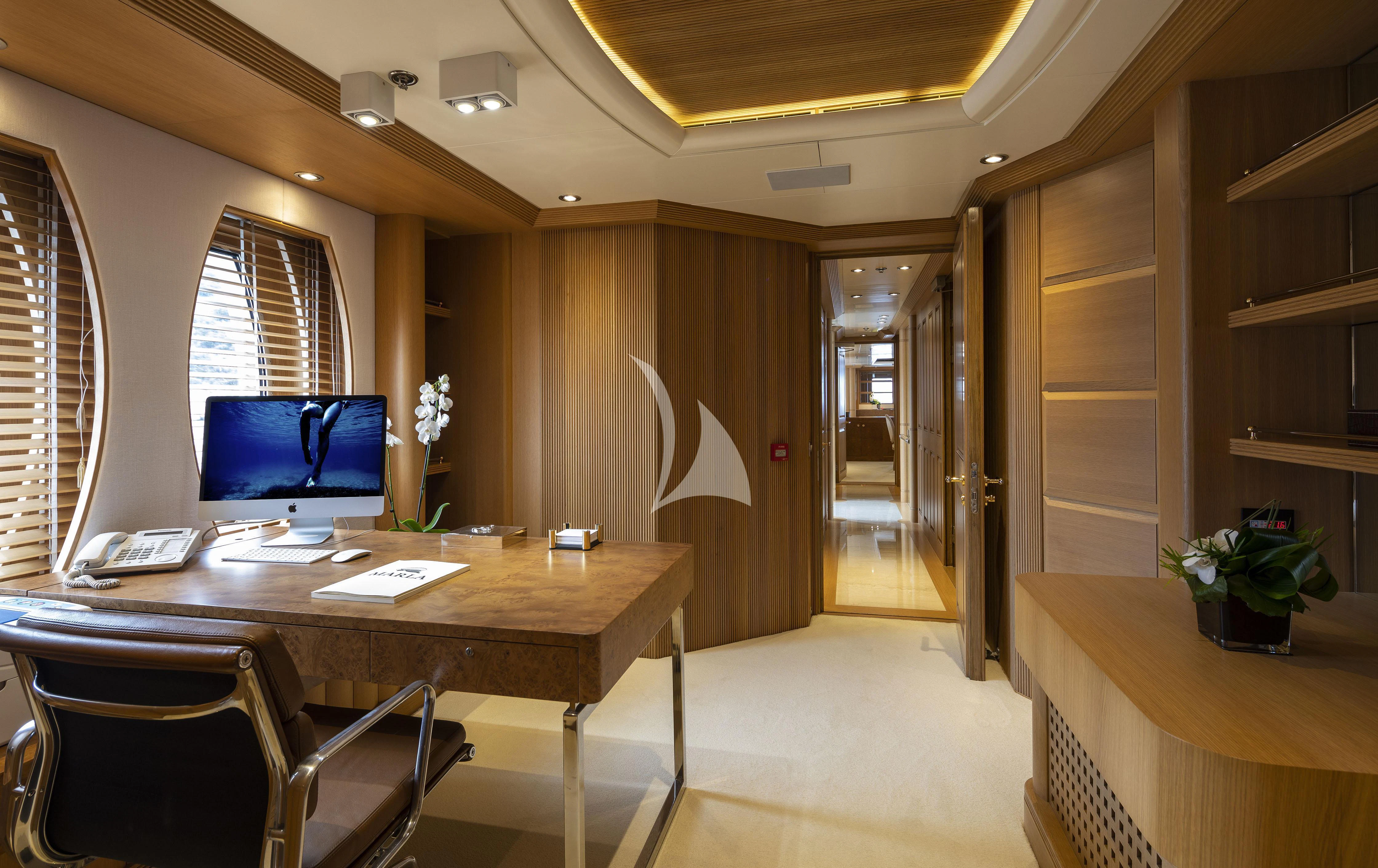 a room with a desk and computer aboard MARLA Yacht for Sale
