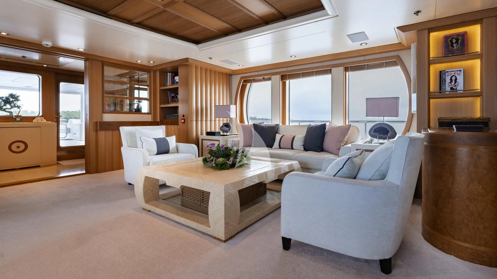 a living room with a couch and a coffee table aboard MARLA Yacht for Sale