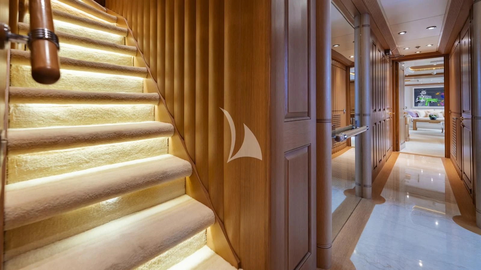 a hallway with a staircase and a door aboard MARLA Yacht for Sale