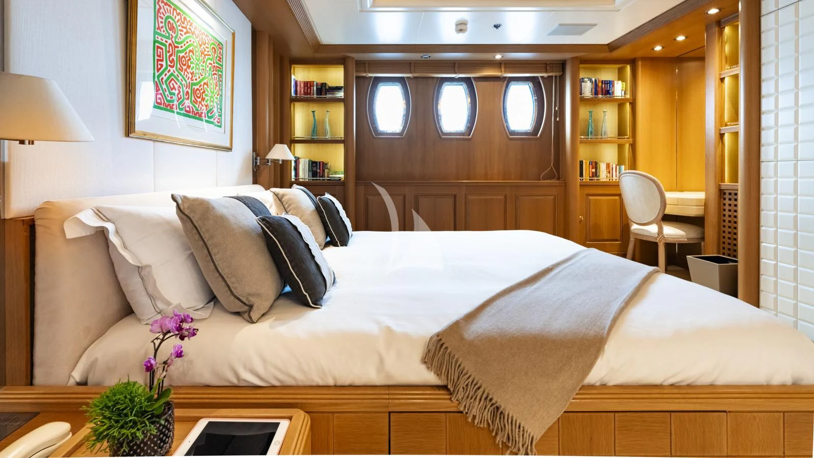 a bed with a white comforter and pillows aboard MARLA Yacht for Sale