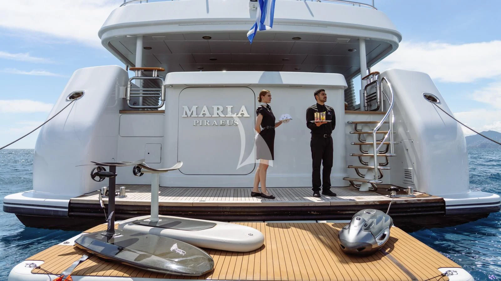 a couple of people standing on a boat aboard MARLA Yacht for Sale