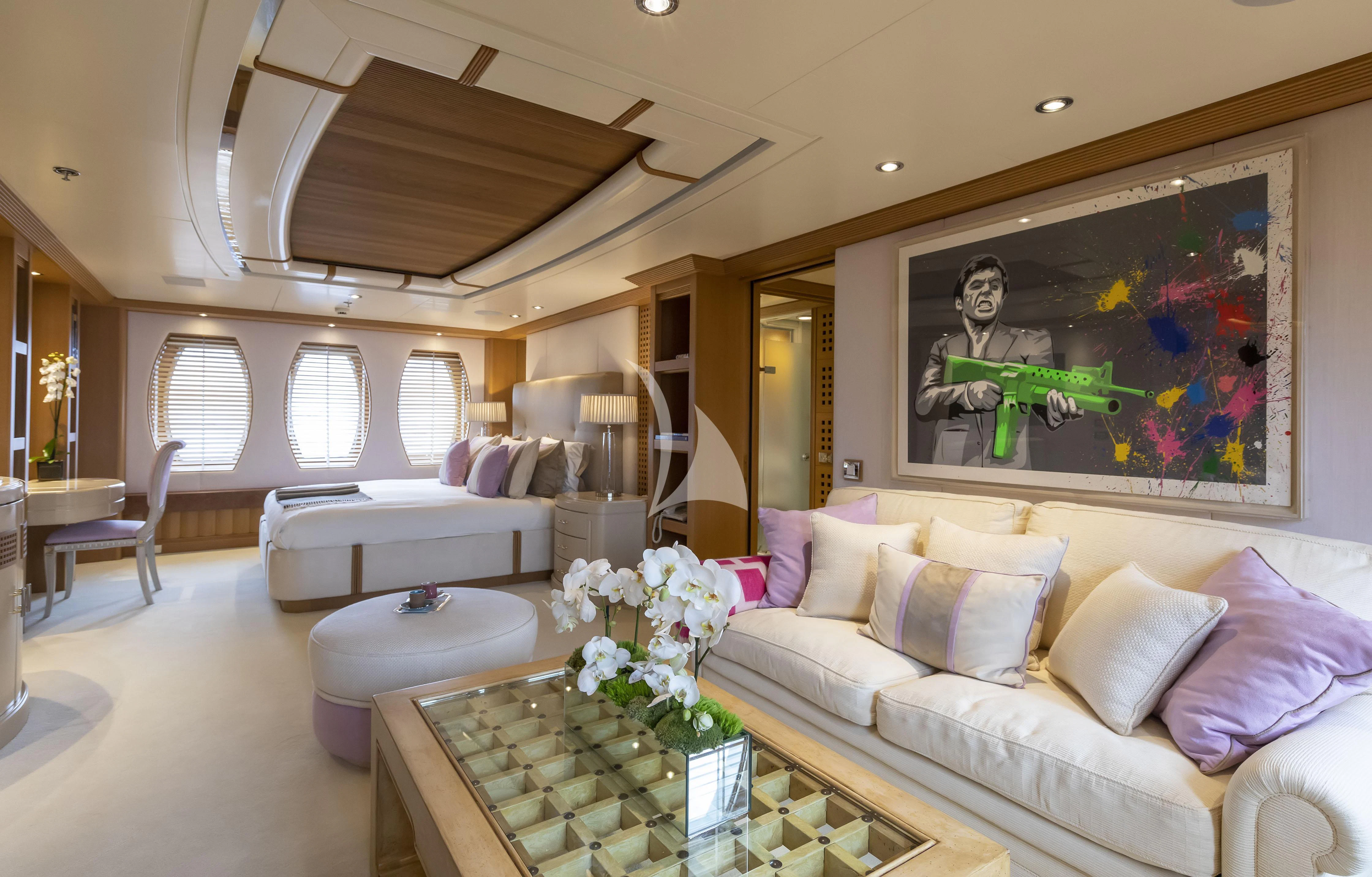 a living room with a couch and a table aboard MARLA Yacht for Sale