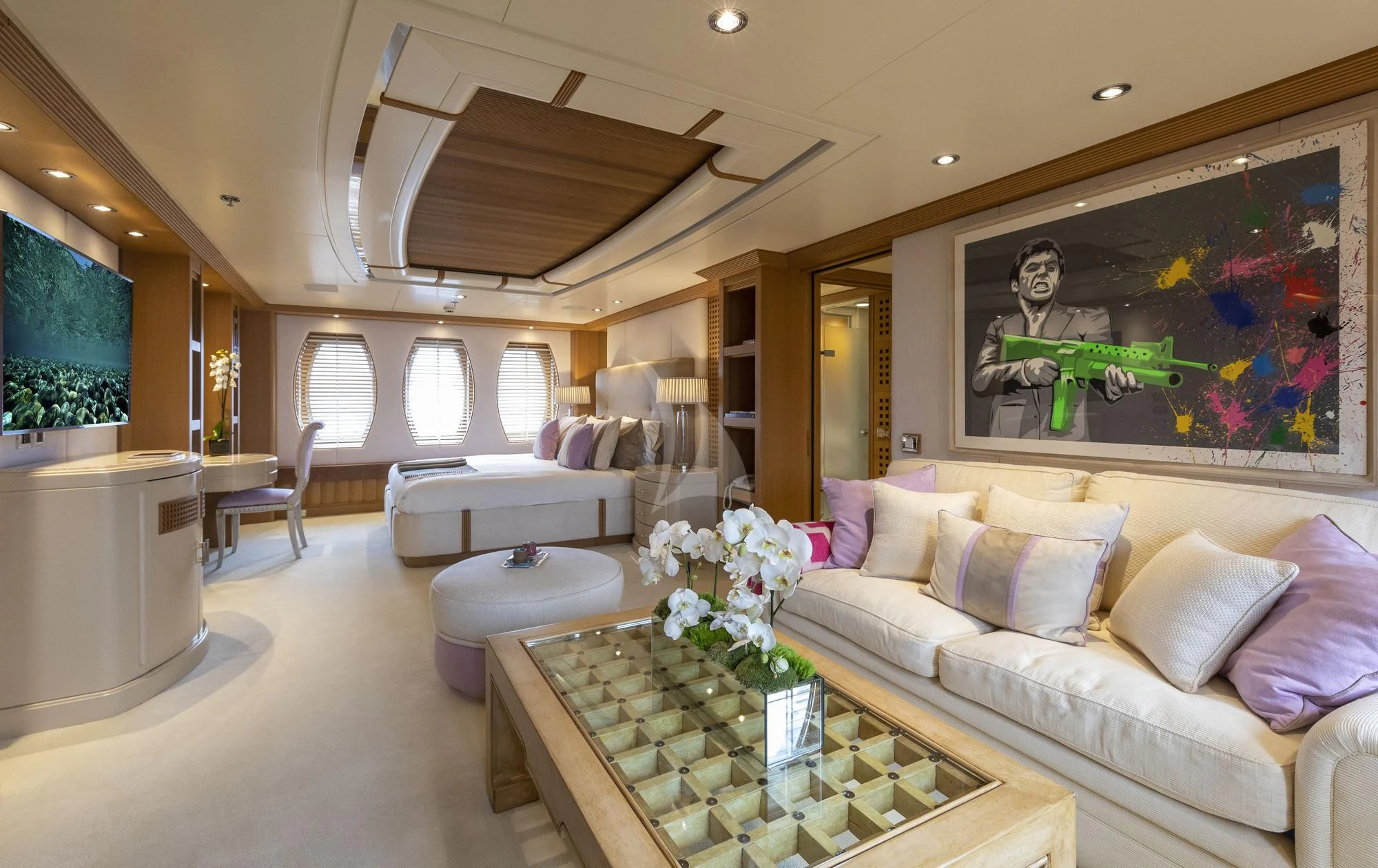 a living room with a large painting aboard MARLA Yacht for Sale