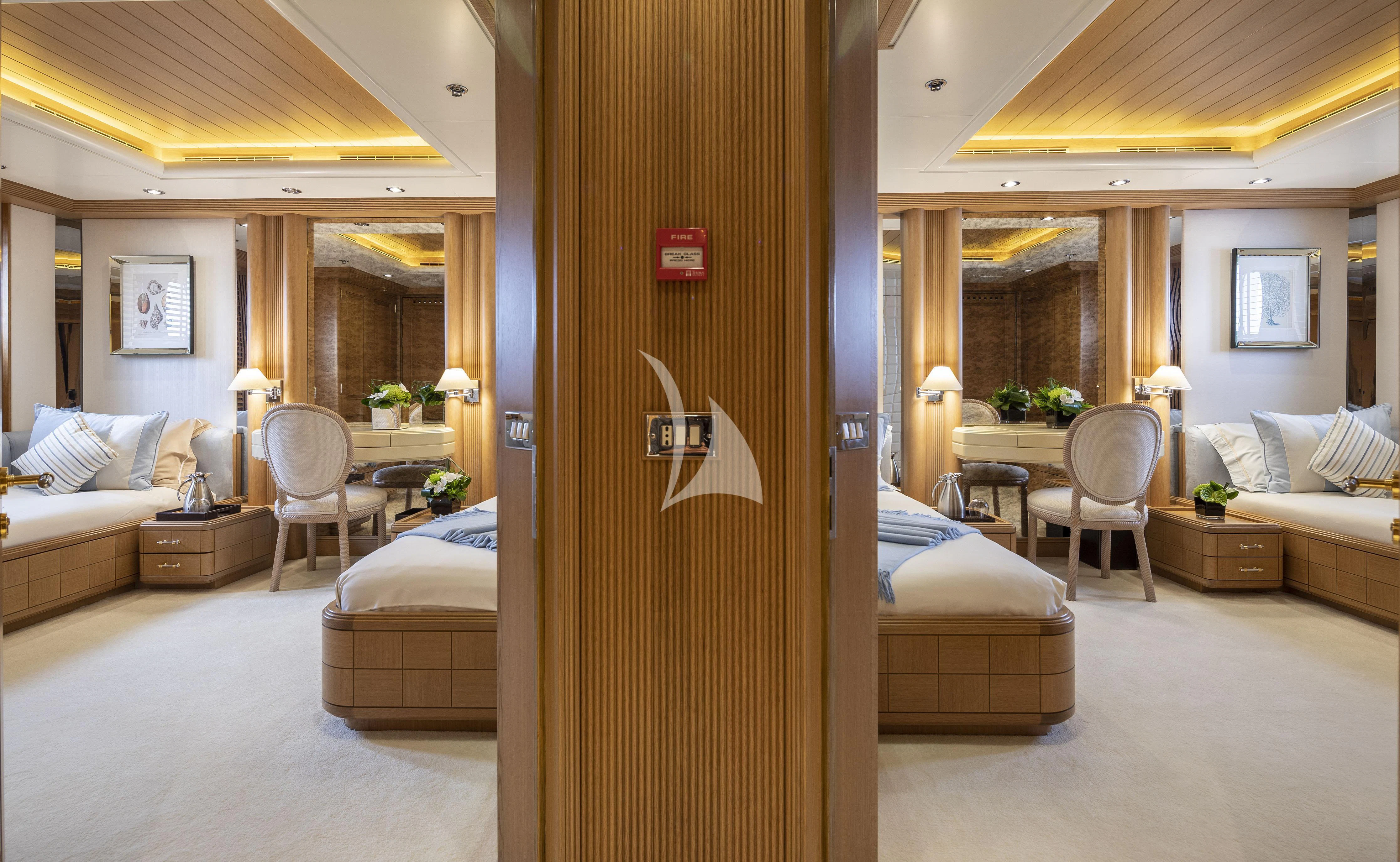 a room with a bed and a desk aboard MARLA Yacht for Sale
