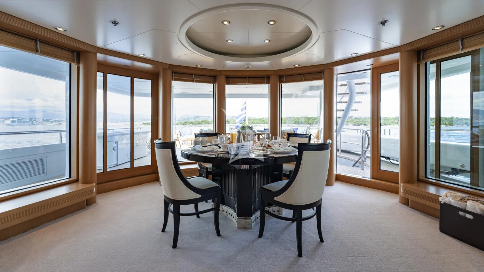 a room with a table and chairs aboard MARLA Yacht for Sale