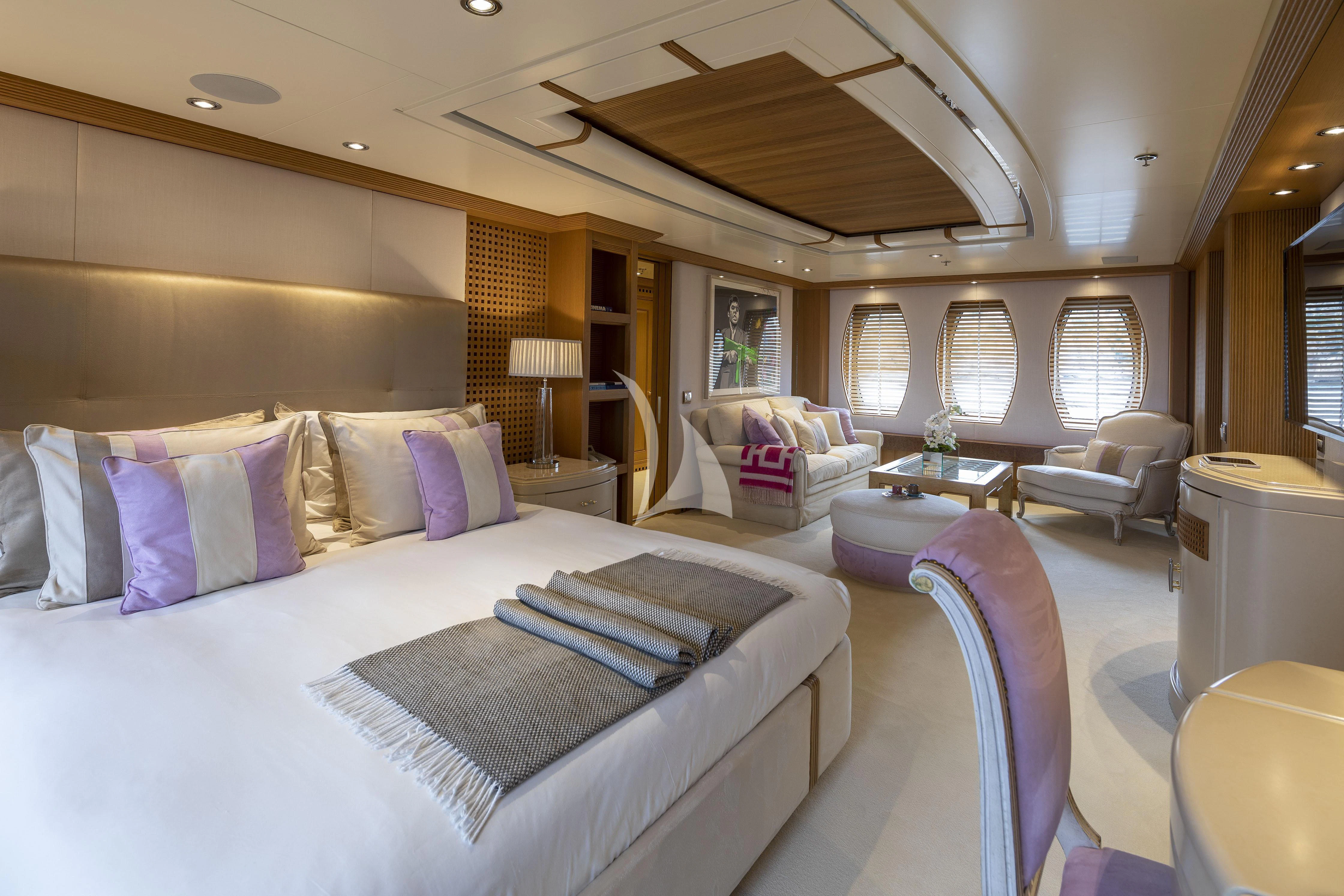 a large bedroom with a large bed aboard MARLA Yacht for Sale