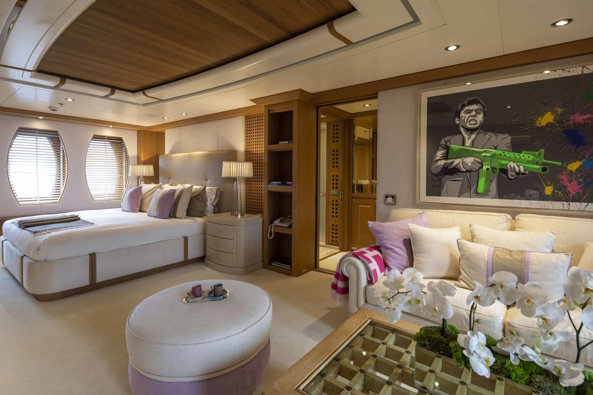 a living room with a large painting aboard MARLA Yacht for Sale