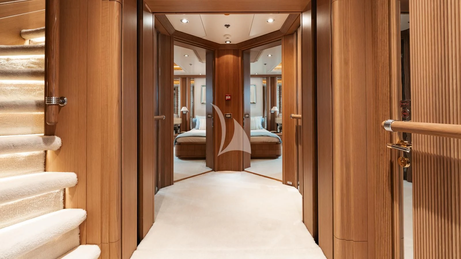 a room with a bed and a mirror aboard MARLA Yacht for Sale