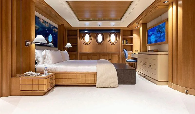 a room with a bed and a tv aboard DEJA TOO Yacht for Sale