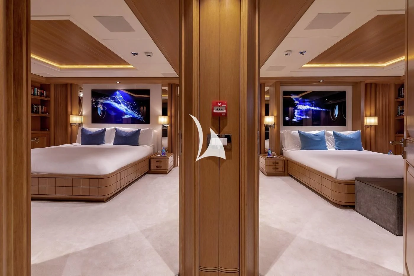 a hotel room with a bed and a tv aboard DEJA TOO Yacht for Sale