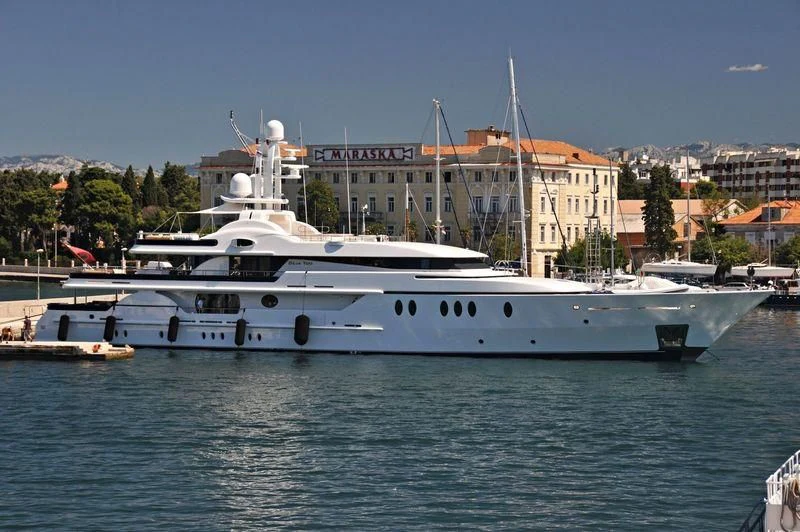 a large white boat in the water aboard DEJA TOO Yacht for Sale