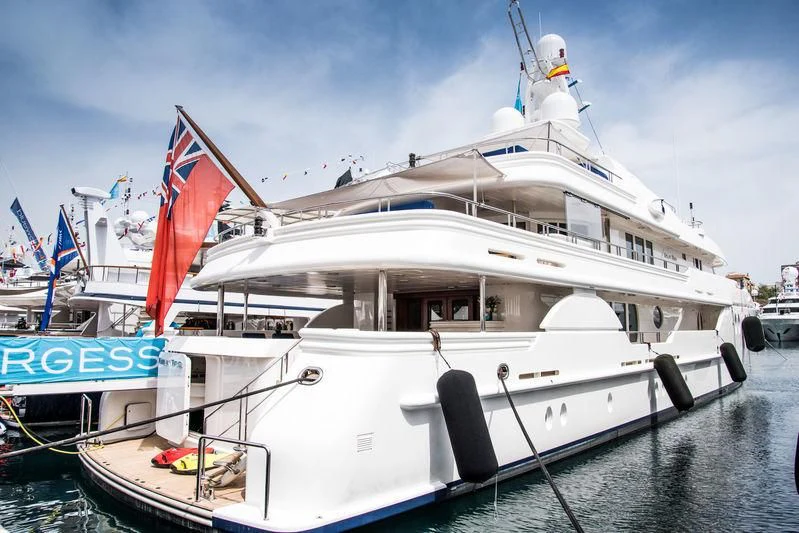 a boat with flags on it aboard DEJA TOO Yacht for Sale