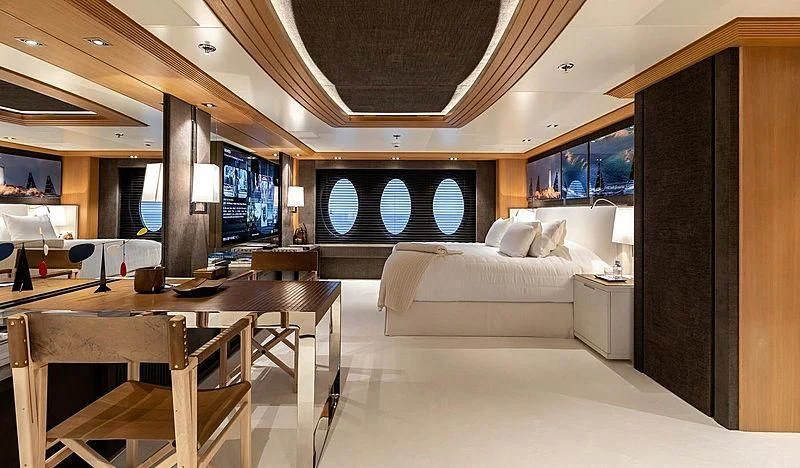 a room with a couch and a table and a tv aboard DEJA TOO Yacht for Sale