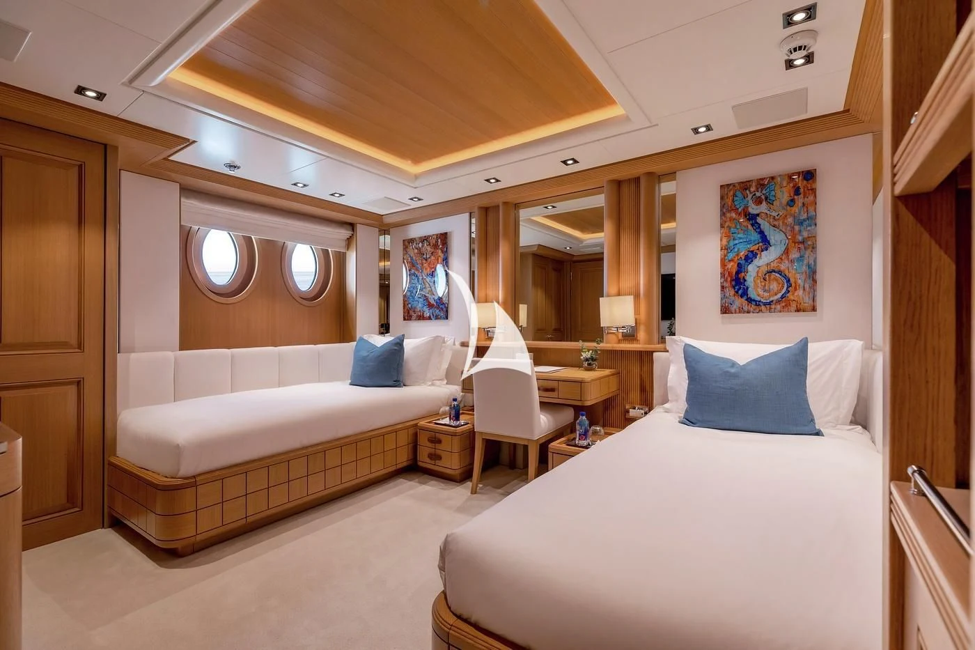 a room with a bed and a chair aboard DEJA TOO Yacht for Sale