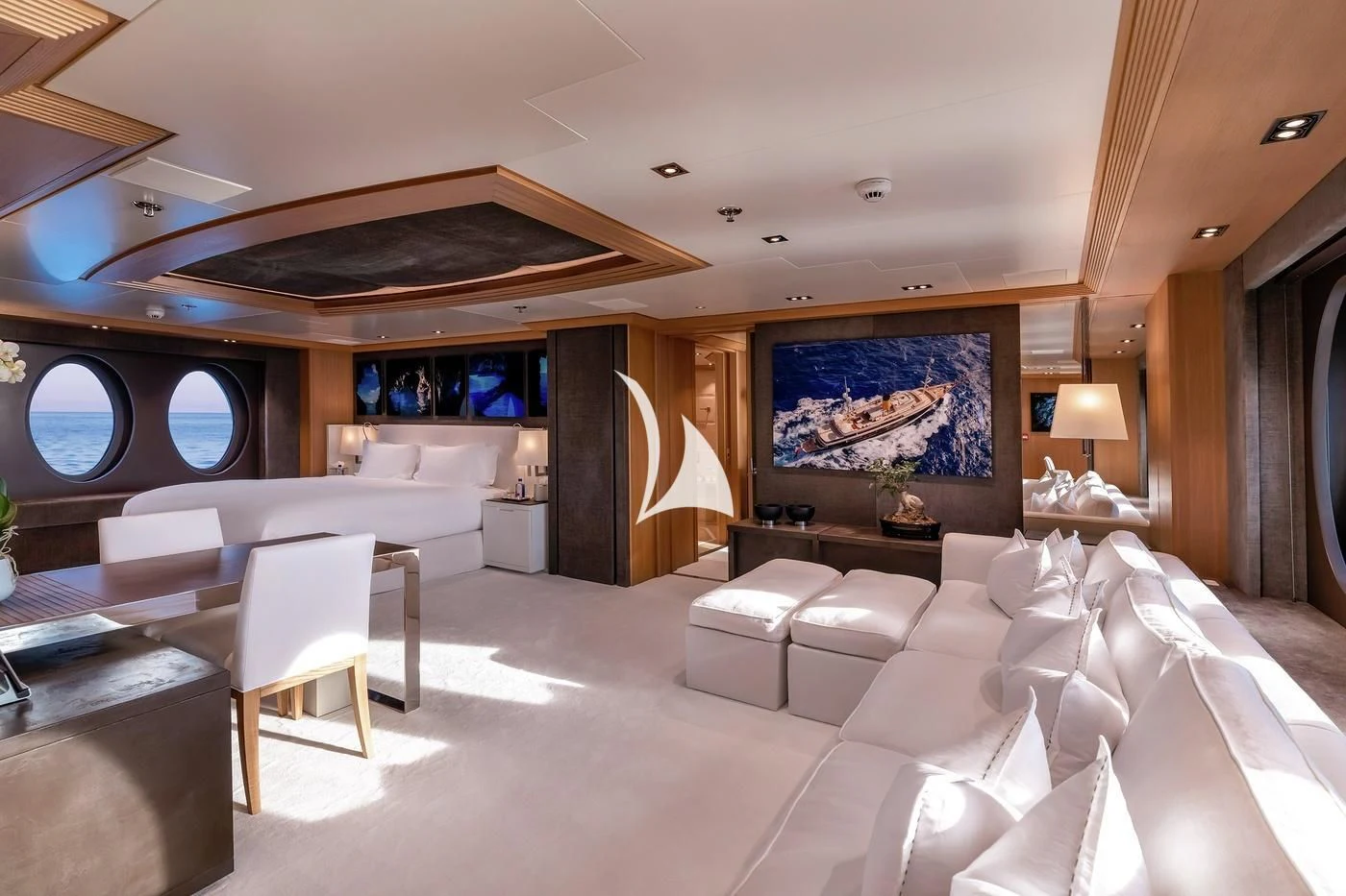 a room with a bed and a table aboard DEJA TOO Yacht for Sale