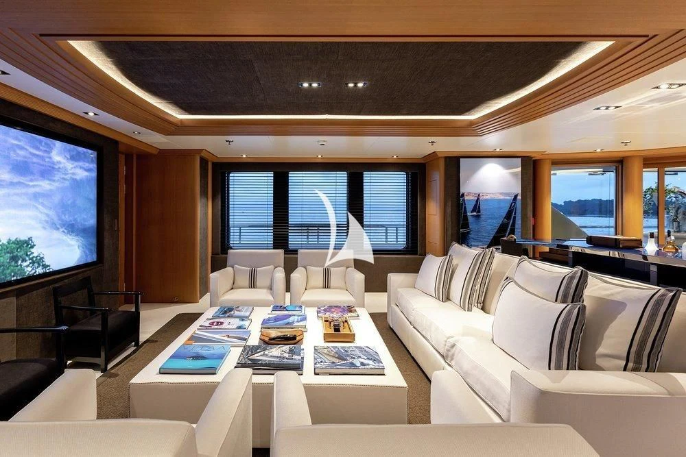 a living room with a large screen aboard DEJA TOO Yacht for Sale