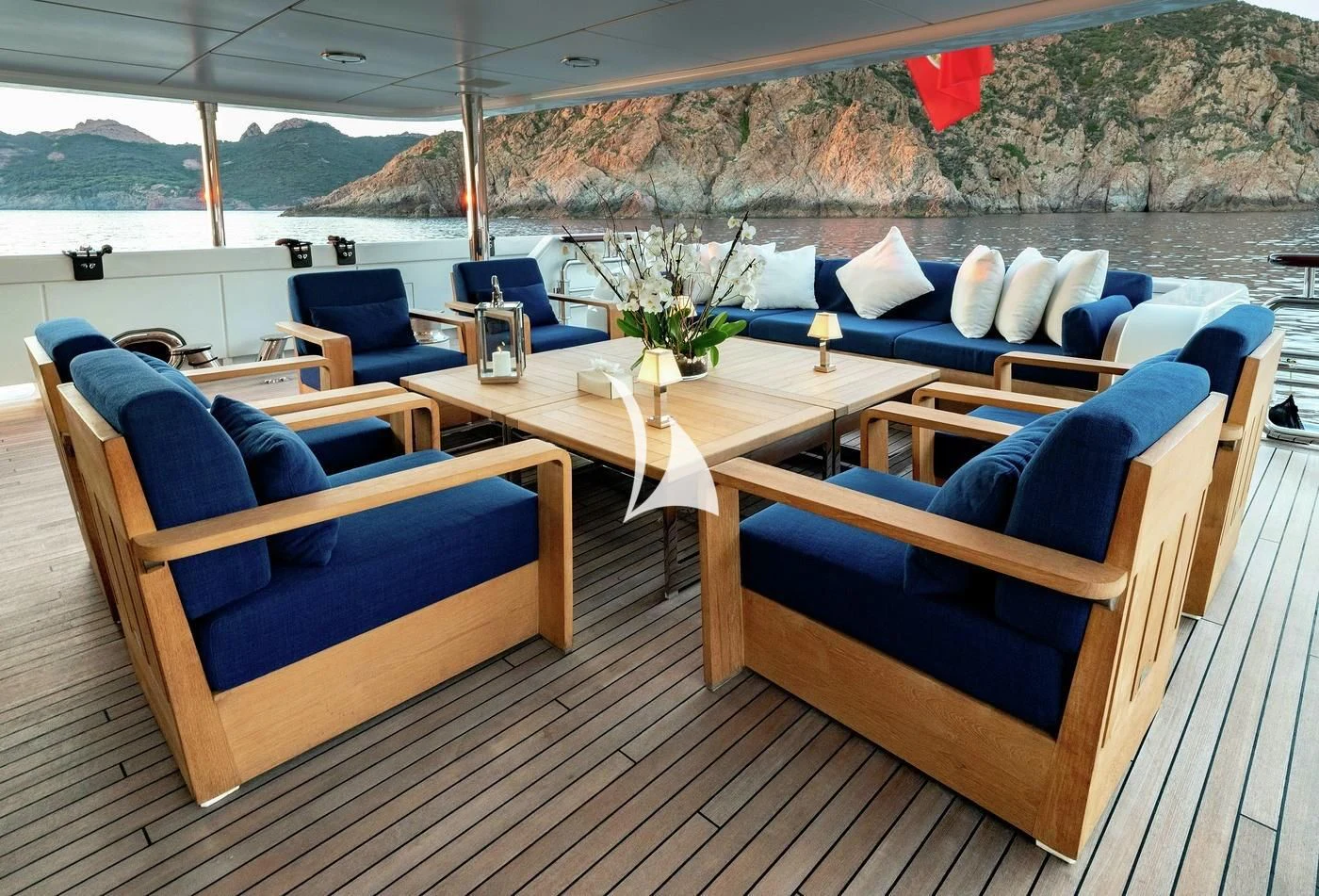 a deck with chairs and tables aboard DEJA TOO Yacht for Sale