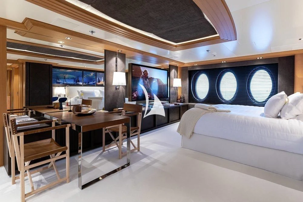 a room with a bed and a desk aboard DEJA TOO Yacht for Sale