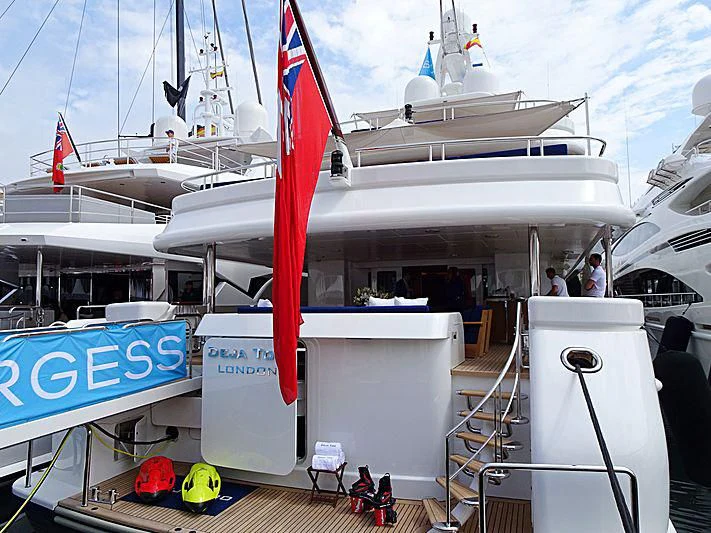 a boat with a red sail aboard DEJA TOO Yacht for Sale