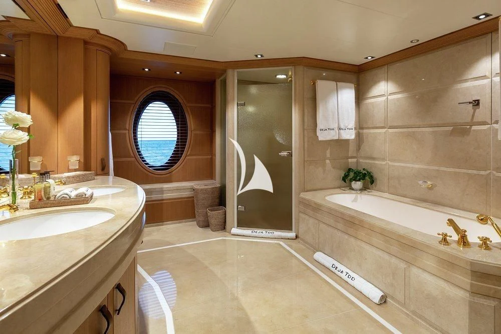 a bathroom with a tub sink and a shower aboard DEJA TOO Yacht for Sale