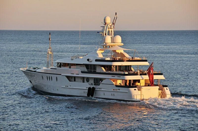 a large white ship in the water aboard DEJA TOO Yacht for Sale