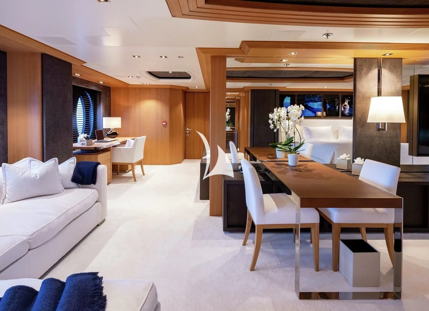 a room with a table chairs and a couch aboard DEJA TOO Yacht for Sale