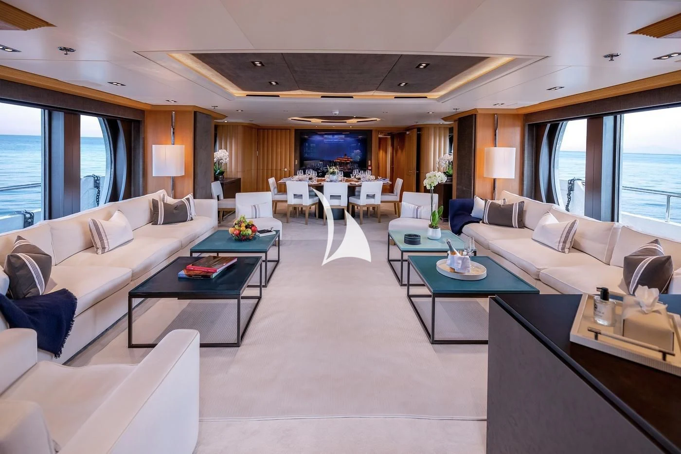 a living room with a couch and a coffee table aboard DEJA TOO Yacht for Sale