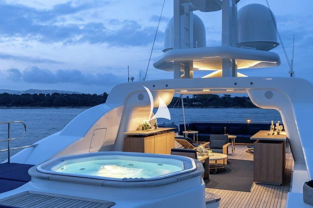 a large white boat on a body of water aboard DEJA TOO Yacht for Sale