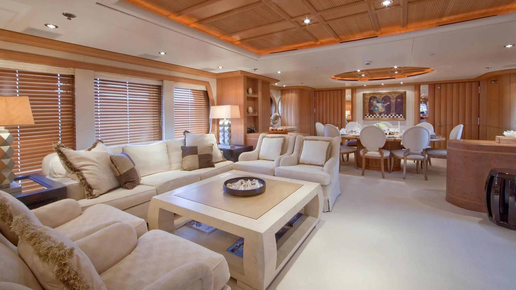 a living room with a couch and a coffee table aboard DEJA TOO Yacht for Sale