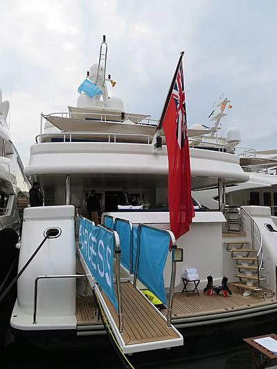 a large boat with flags on it aboard DEJA TOO Yacht for Sale