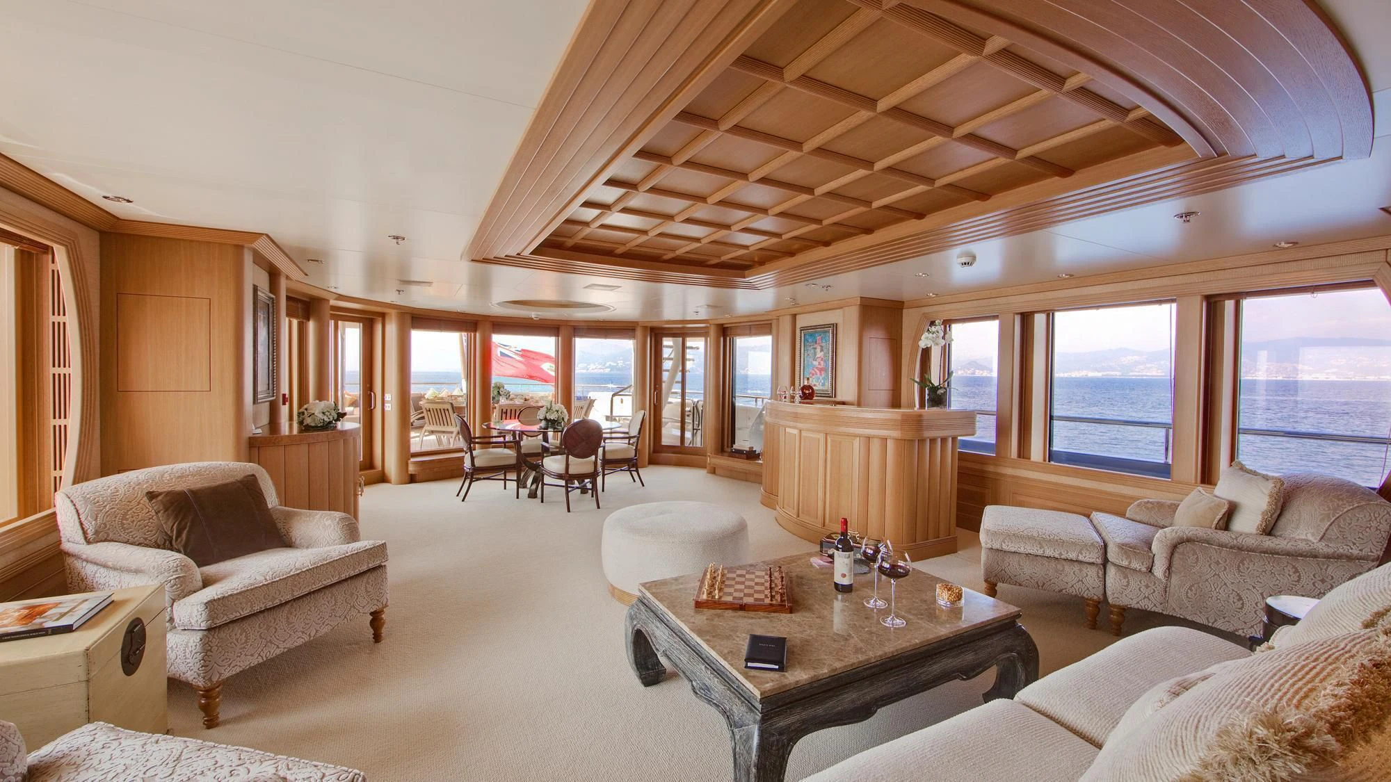 a living room with a large window aboard DEJA TOO Yacht for Sale