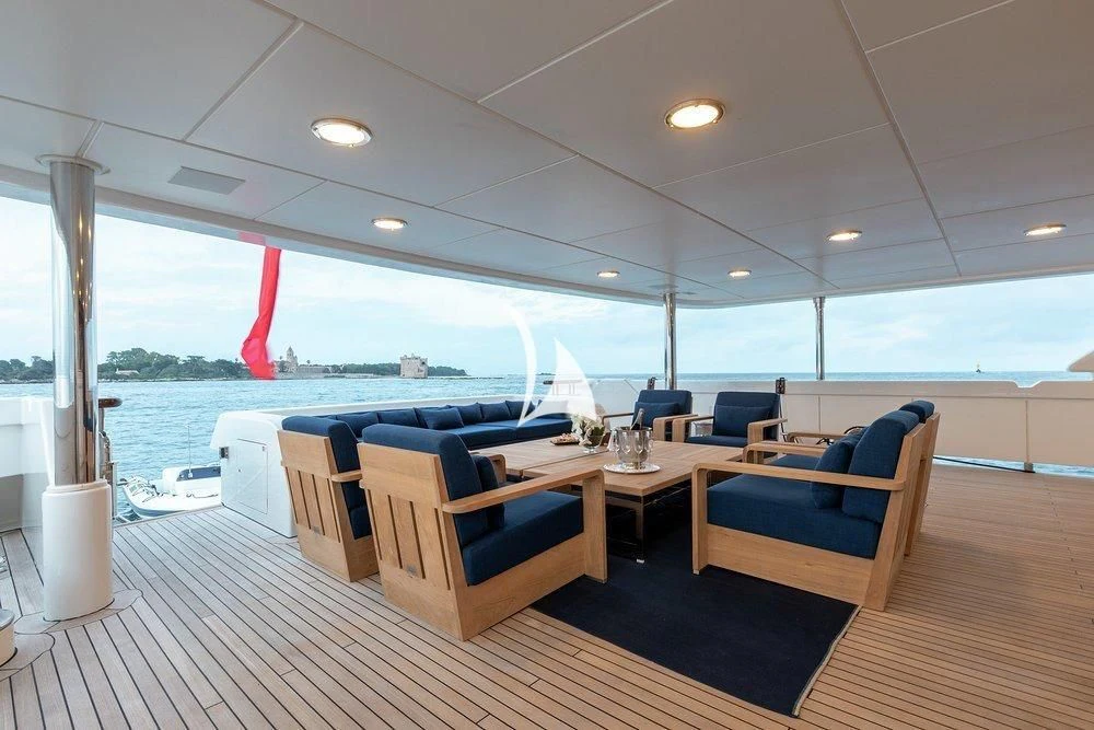 a room with a large window and a view of the water aboard DEJA TOO Yacht for Sale