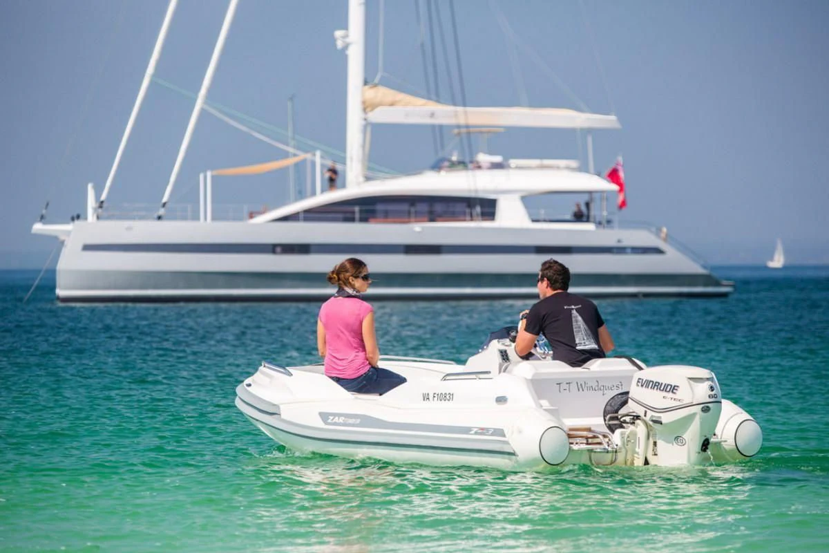 a couple people on a boat aboard WINDQUEST Yacht for Sale