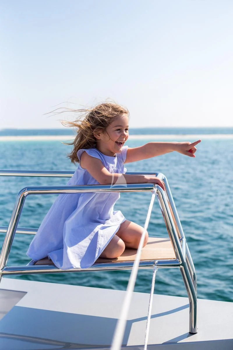 a girl on a boat aboard WINDQUEST Yacht for Sale