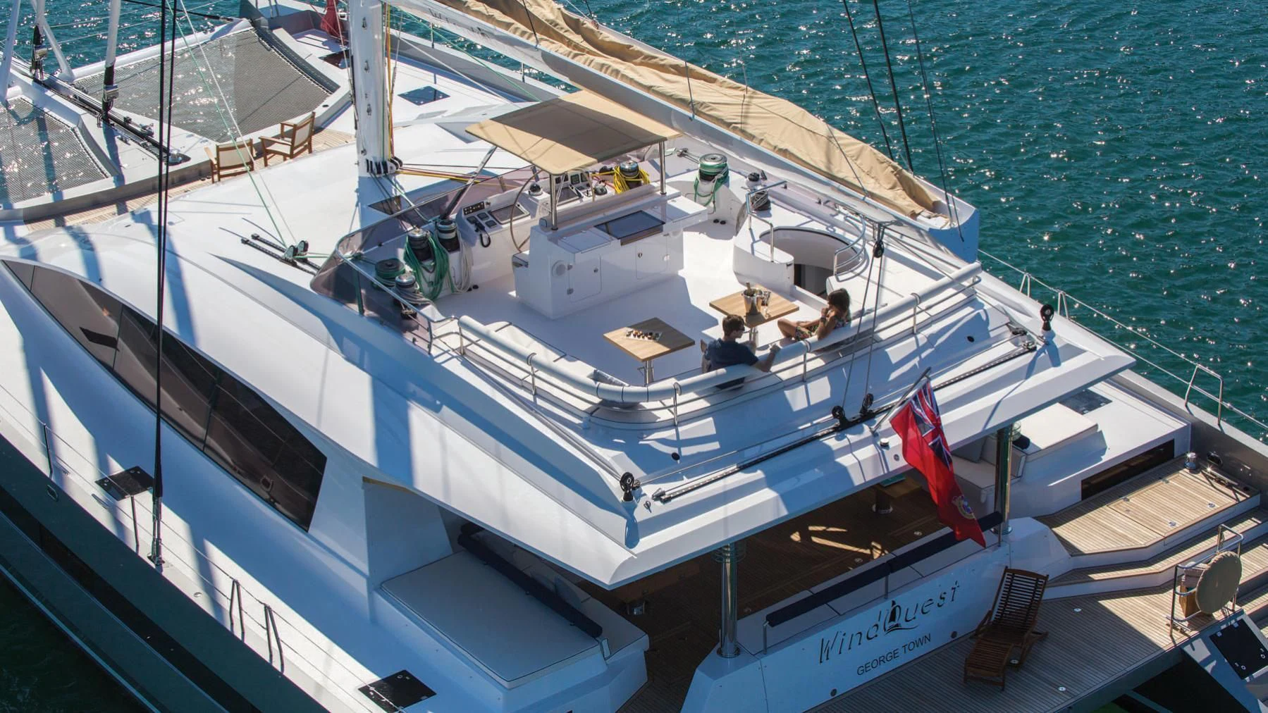 a large white boat with people on it aboard WINDQUEST Yacht for Sale