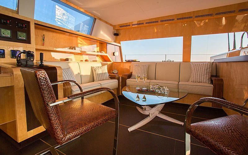 a living room with a couch and a table aboard WINDQUEST Yacht for Sale