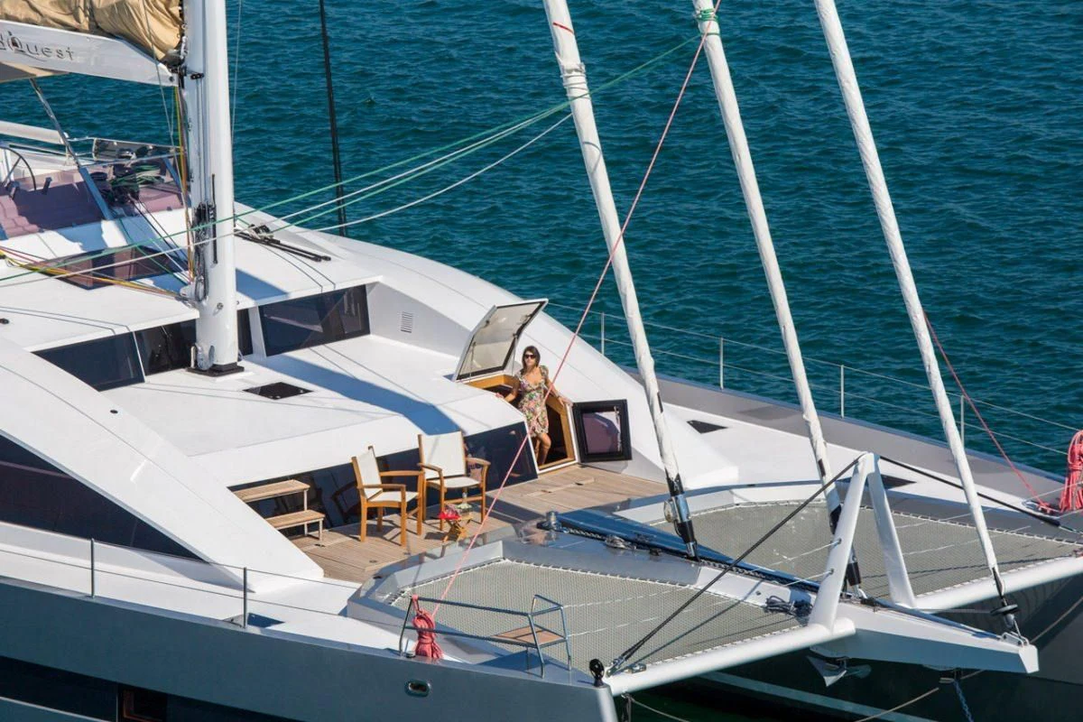a couple of people on a boat aboard WINDQUEST Yacht for Sale