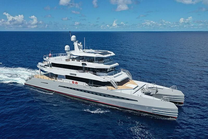 a large ship in the water aboard MAGNET Yacht for Sale