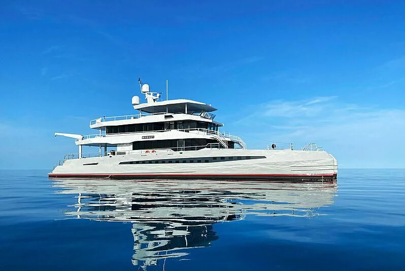 a large white boat in the water aboard MAGNET Yacht for Sale