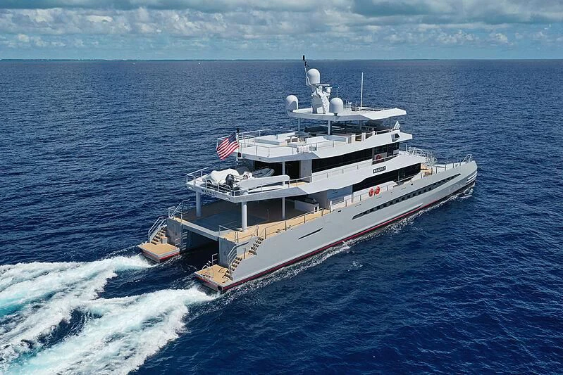 a large ship in the water aboard MAGNET Yacht for Sale
