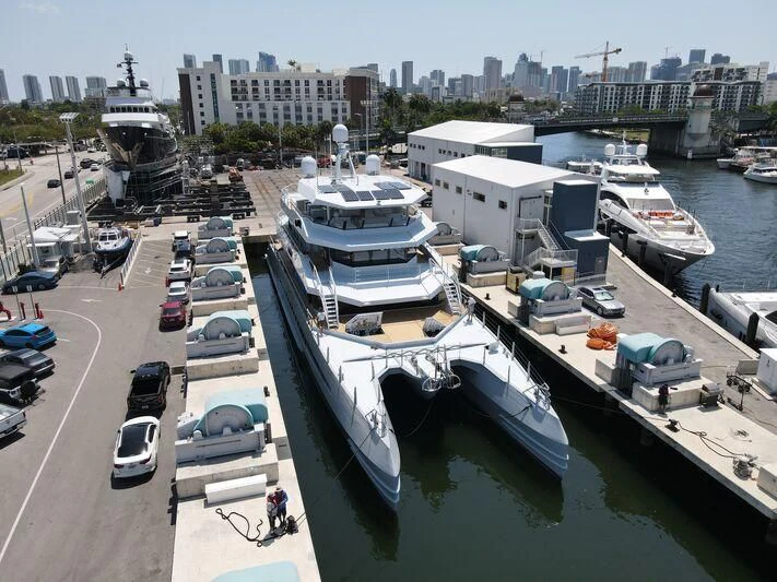 a marina with boats and cars aboard MAGNET Yacht for Sale