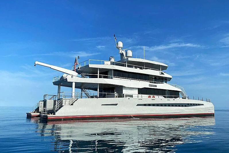 a large white ship in the water aboard MAGNET Yacht for Sale