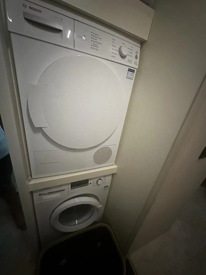 a white washing machine aboard LADY G Yacht for Sale