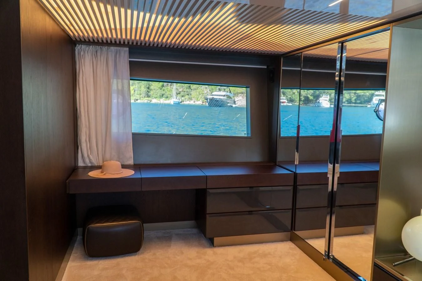 a room with a window and a bench aboard LADY G Yacht for Sale