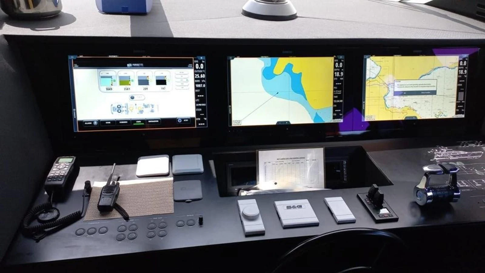 a computer with a screen and game controllers on it aboard LADY G Yacht for Sale